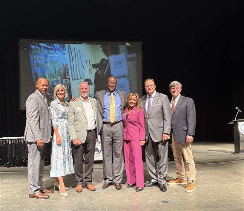 BOE members at leadership standing on stage